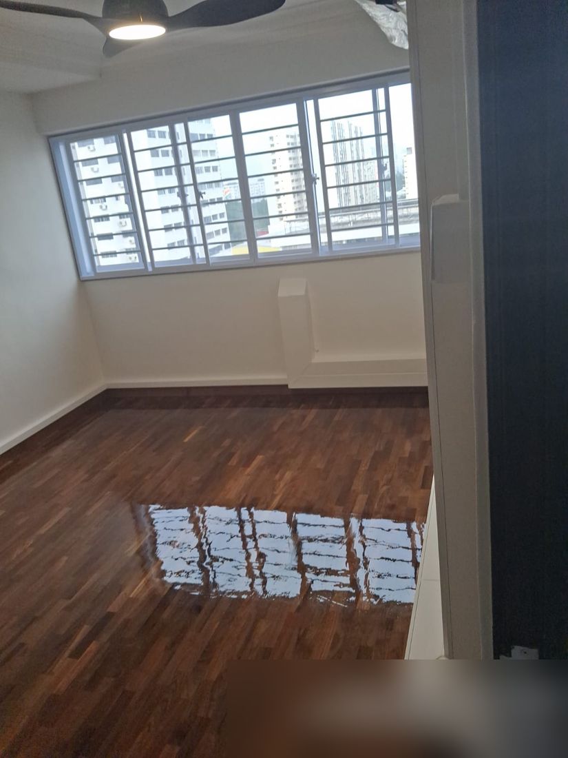 High-gloss dark parquet room with window reflections