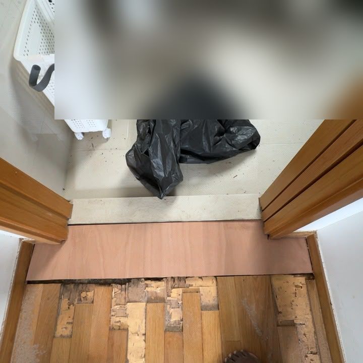 New plywood base fitted across a bathroom threshold